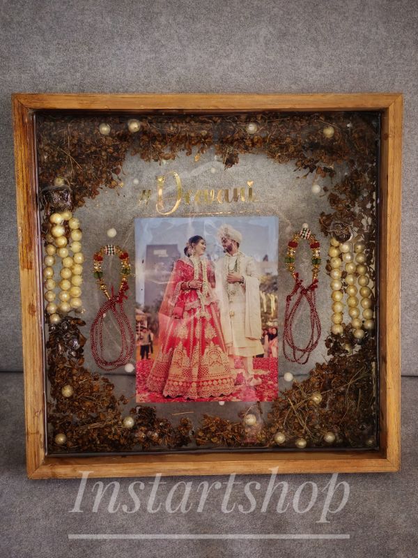 Golden Embrace: Glittering Wedding Frame with Feather & Couple Photo